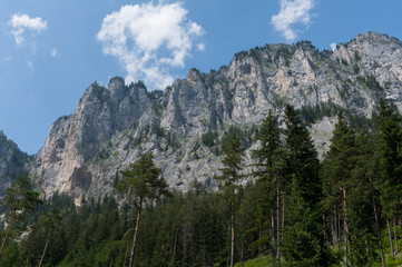 Fototapeta na wymiar Towering rocky peaks of the Austrian Alps