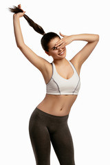 Beautiful smiling happy slim young sporty fitness woman