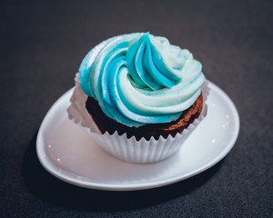 Chocolate caramel cupcake with nuts and butterscotch syrup