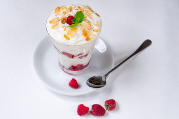 ice-cream scoop vanilla and fruit with raspberry decorated by mint