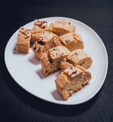 French cookies with jam on the white plate.