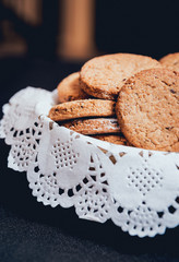 French cookies with jam on the white plate.