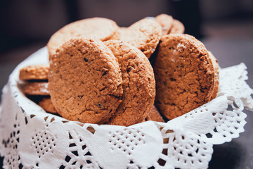 French cookies with jam on the white plate.