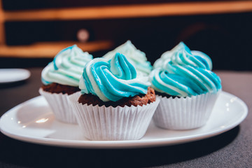 Chocolate caramel cupcake with nuts and butterscotch syrup