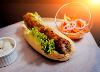 Grilled chicken seekh kebab with fresh bun and cheese.