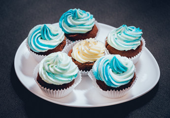 Chocolate caramel cupcake with nuts and butterscotch syrup
