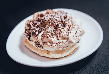 French meringue cookies on the white plate.