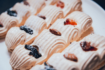 French meringue cookies on the white plate.