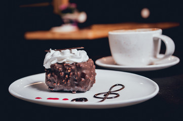 Dessert with cream on the wihte plate