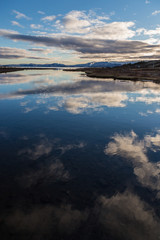 Clouds reflecting in the silent lakes of Iceland