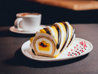 Dessert with cream on the wihte plate