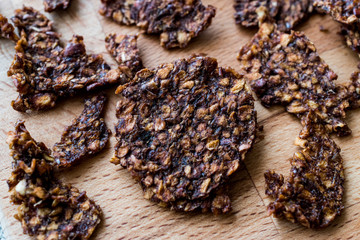 Apple and Cinnamon Chips on wooden surface.