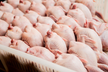 Fresh chicken bodies in a basket