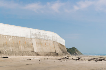 High concrete wall at seaside for protect tsunami big wave