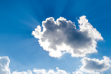 Rays of the sun from behind the cloud