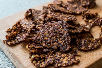 Apple and Cinnamon Chips on wooden surface.