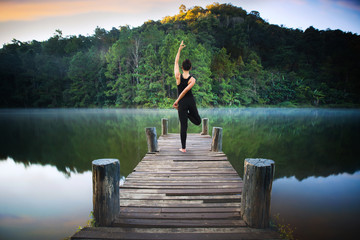 Yoga post on the wooded bridge