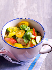 Colorful vegetable salad with basil