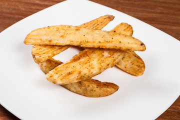 portion of french fries on a white plate