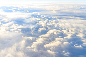 Fototapeta na wymiar clouds sky skyscape. view from the window of an airplane flying in the clouds, top view clouds like the sea of clouds sky background