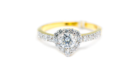 Gold ring with diamond on heart shape isolated