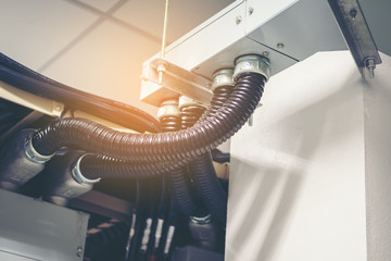Cable tray with electrical wiring arranged on ceiling ,Cable tray epoxy dark grey : Houses runs of control and power cable used for cable and wire junction distribution and termination