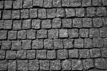 the stone pavement. Pavement of cobblestones. Background. the texture of the stones, free the empty space