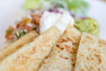 Homemade Quesadilla with chicken in the plate close-up shot, Bali island, Indonesia.