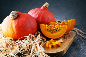 Pumpkin slices with seeds and autumn hokkaido pumpkins