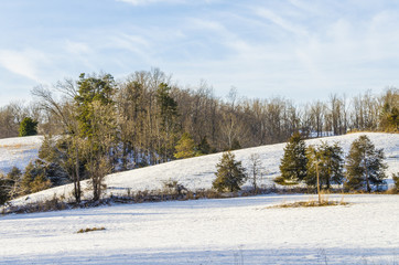 Meadow hill covered in winter snow in Virginia