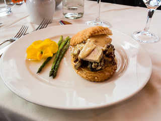 A gourmet appetizer of asparagus, foie gras and mushrooms