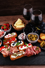 Fototapeta na wymiar Italian antipasti wine snacks set. Cheese variety, Mediterranean