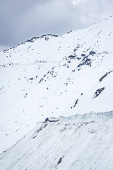 Pass on the mountain covered by snow to Nubra Valley in winter, Ladakh, Jammu and Kashmir, India.