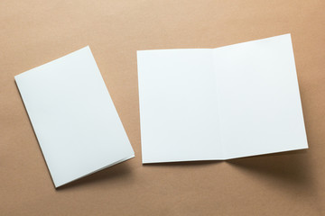 White empty card on brown background to replace your design, mockup.