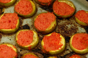 Sliced zucchini in tomato cooked in oven