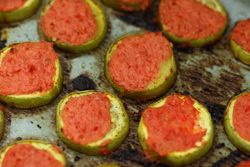 Sliced zucchini in tomato cooked in oven