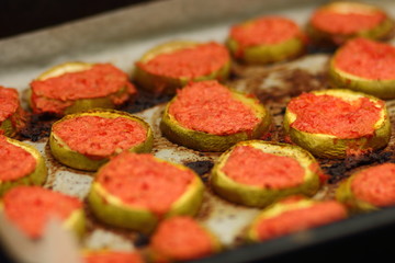 Sliced zucchini in tomato cooked in oven