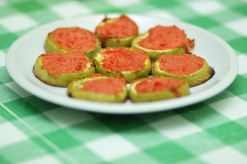Sliced zucchini in tomato cooked in oven