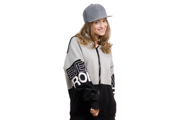 Girl hip-hop in a jacket with a cap