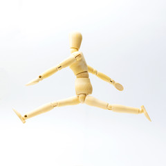 Wooden figure doll with jumping emotion for success business concept on white background