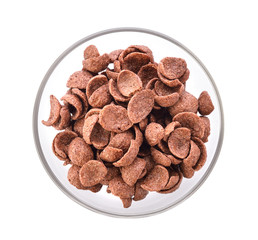 Chocolate corn flakes in a bowl on white background