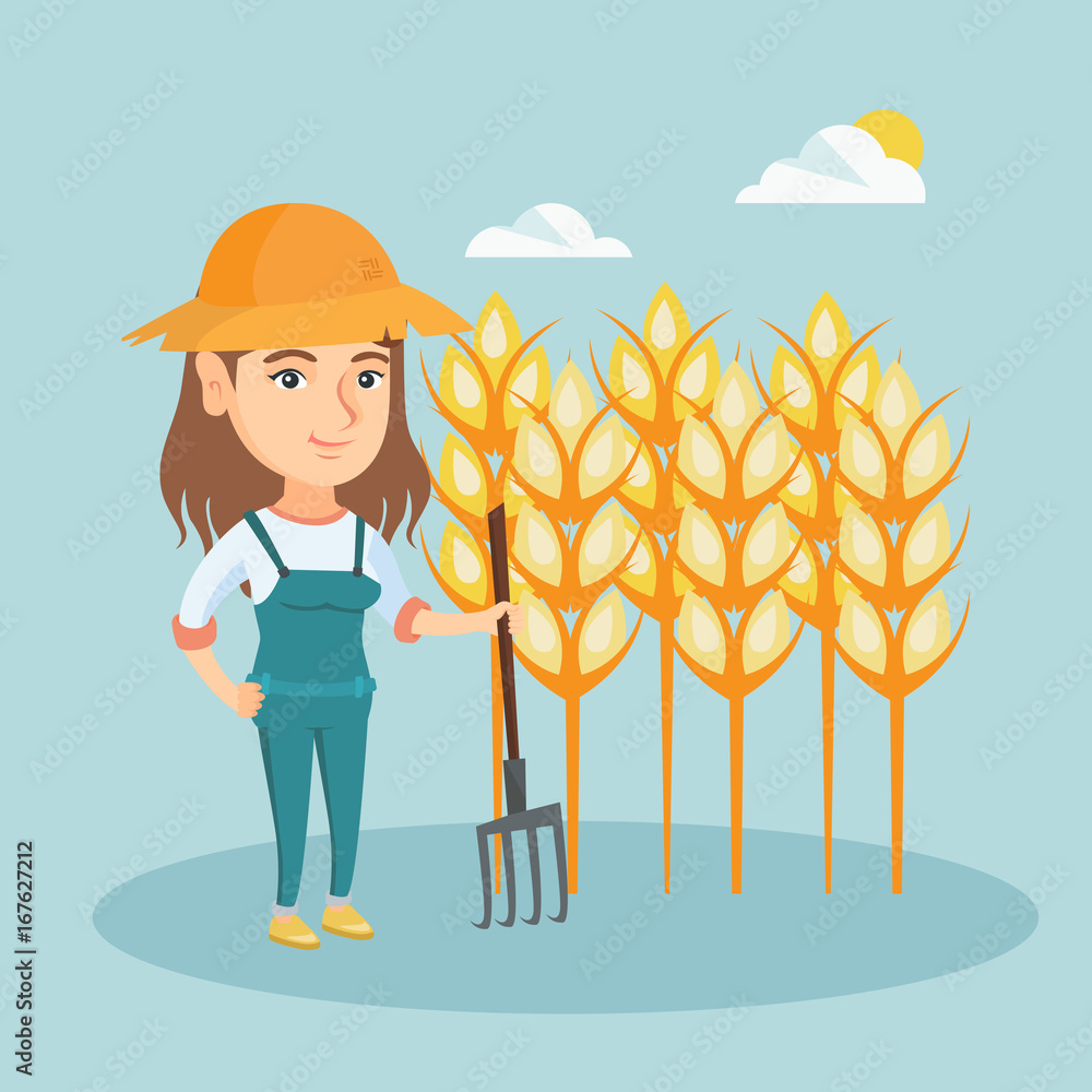 Poster young caucasian farmer in summer hat standing with a pitchfork on the background of a wheat field. s