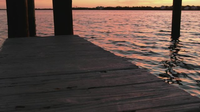 flowing water and docks during sunset off the cost of florida