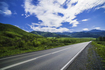 Asphalt road in the mountains of Altai