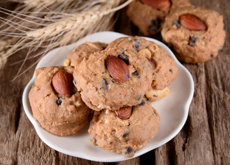homemade almond cookies on wooden background.