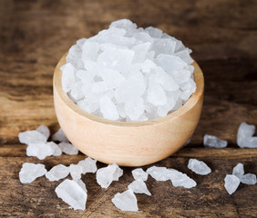 Rock sugar on wood background.