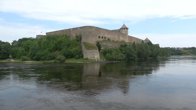 Panorama of the fortress Ivangorod on the Narva river, cloud day in august. Ivangorod, Russia
