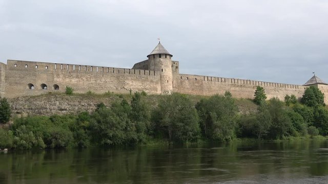 Ivangorod fortress on the river Narva cloud day in august. Russia