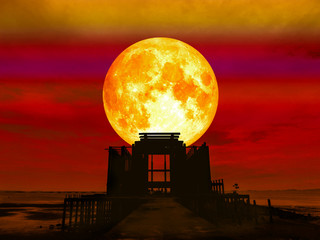 super full blood moon over abandon temple in the sea