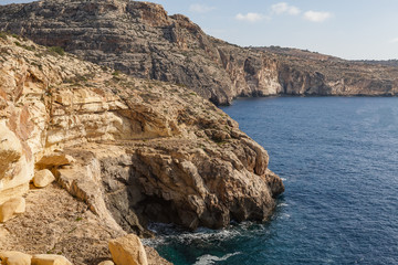Fototapeta na wymiar Blue Grotto limestone cliff, majestic nature landmark of Malta island